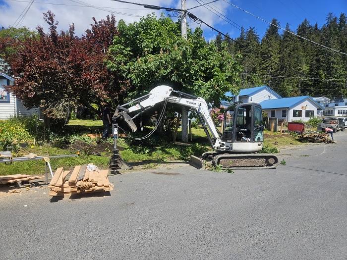 excavator with auger